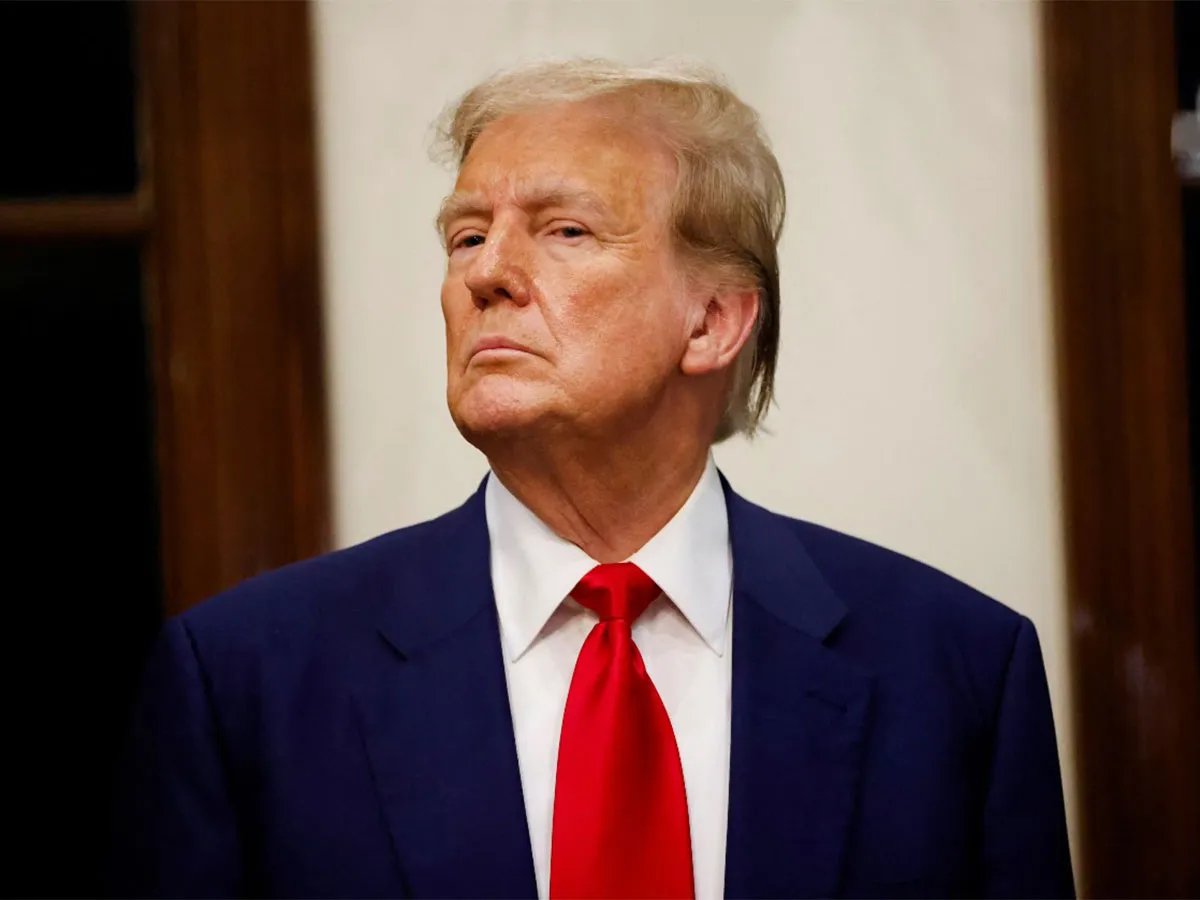 Obnoxious self-centered Trump looking down his nose